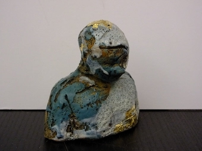 Blue and Gold Figure Looking Down